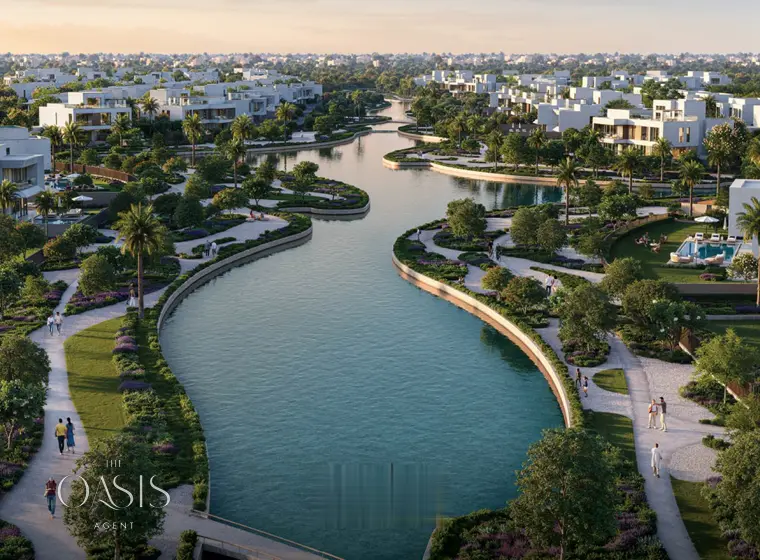 The urban canal winding between the landscaped banks