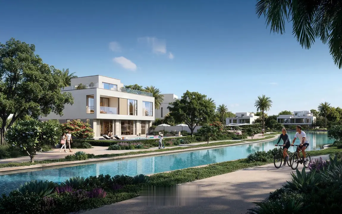 Cycling path alongside a waterway at The Oasis